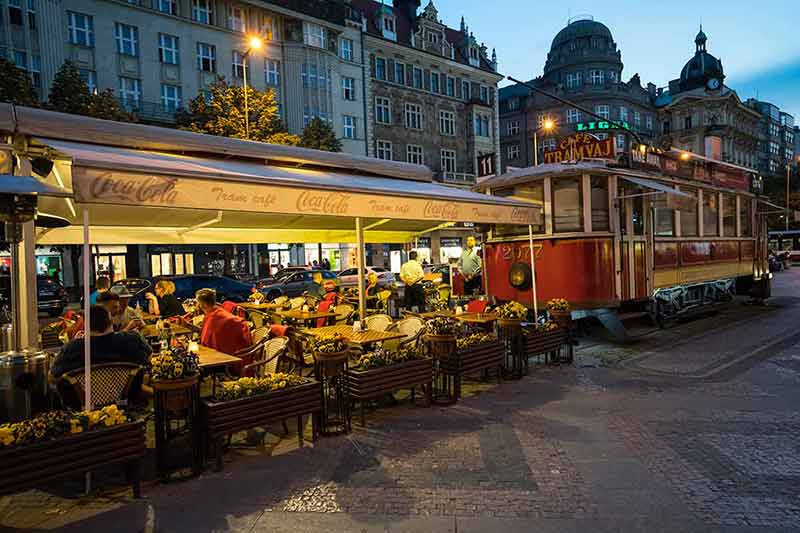 what to do in prague at night outdoor restaurant and tram