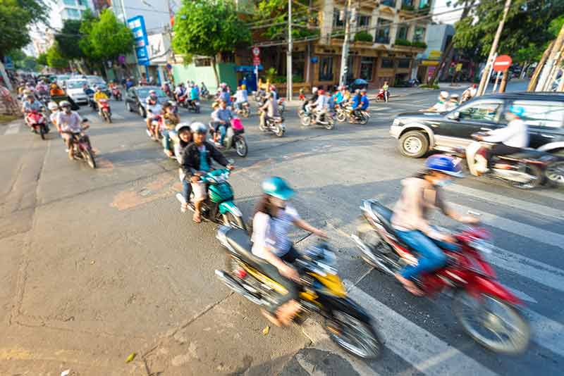Stream Of Bikes In Busy Street In Vietnam