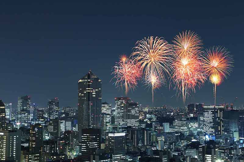 when is the best time of year to visit japan Fireworks over the Tokyo cityscape at night