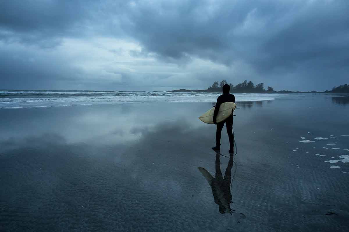 Surfer Heading Out In The Ocean