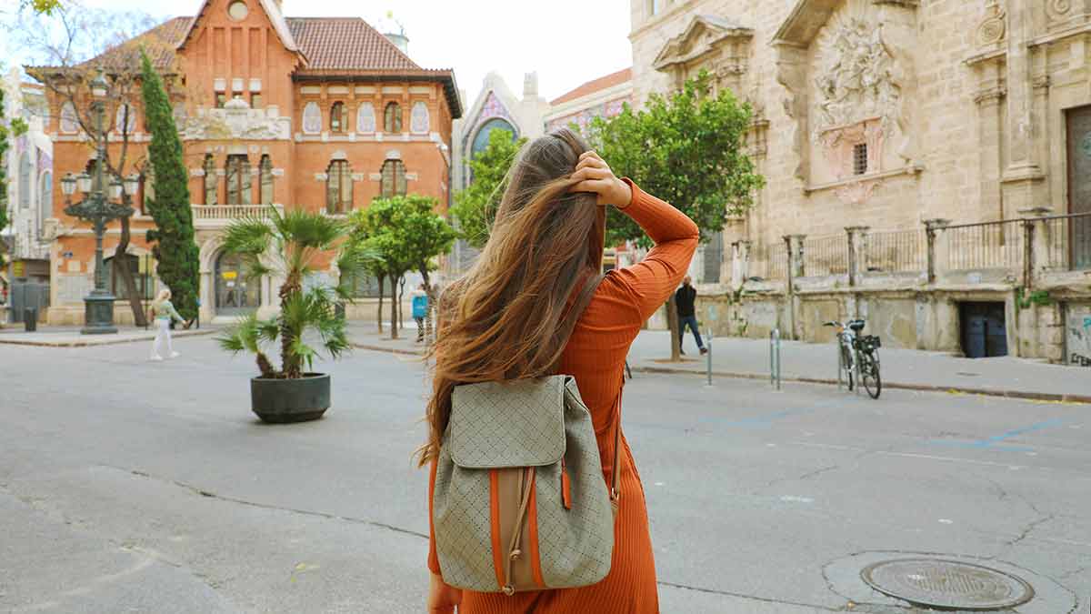 Young female backpacker visits the city of Valencia