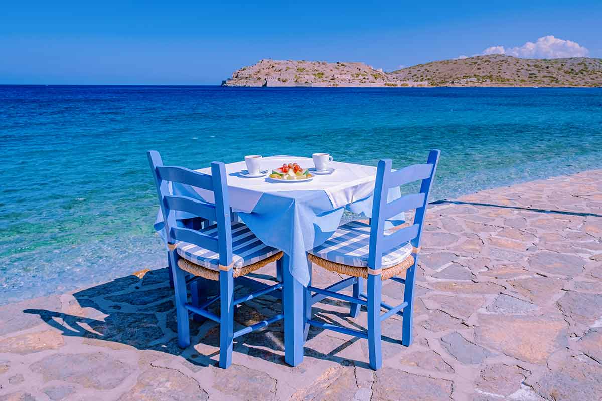 table for two with table cloth by the ocean