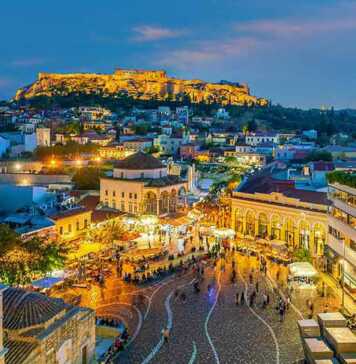 where to stay in athens for cheap cityscape with The Acropolis and the Parthenon Temple in Greece at sunset from Monastiraki Square.