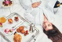 Where to Stay in Los Angeles: The Best Areas for Every Traveller where to stay in los angeles as a tourist an attractive young woman in a bathrobe enjoying a luxurious breakfast in her room.