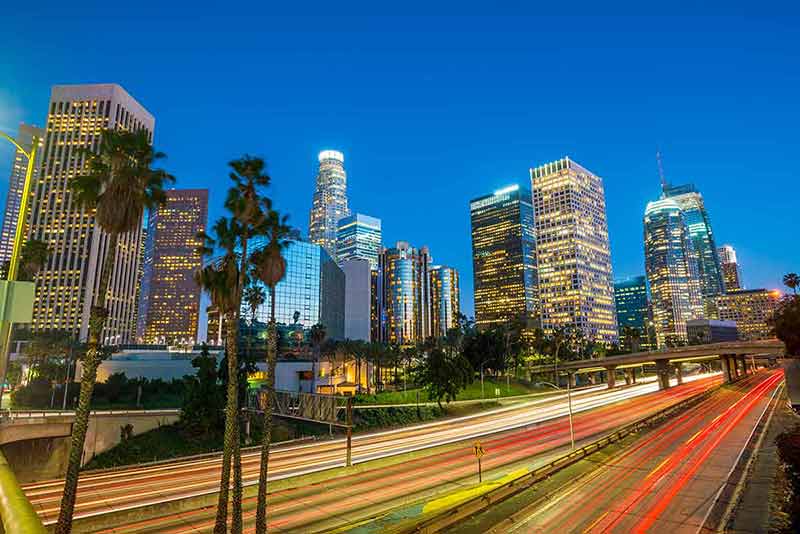 where to stay in los angeles california night traffic and buildings