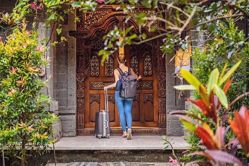 Young Beautiful Woman Check In Authentic Hotel In Bali