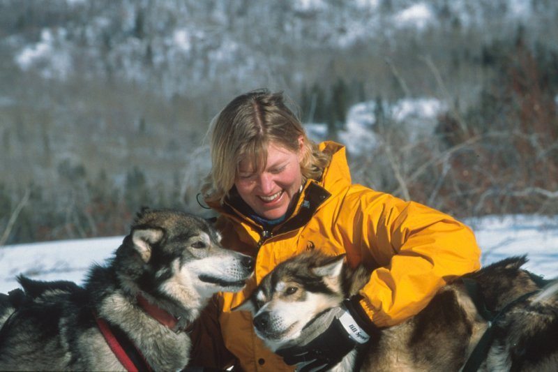 woman with two sled dogs